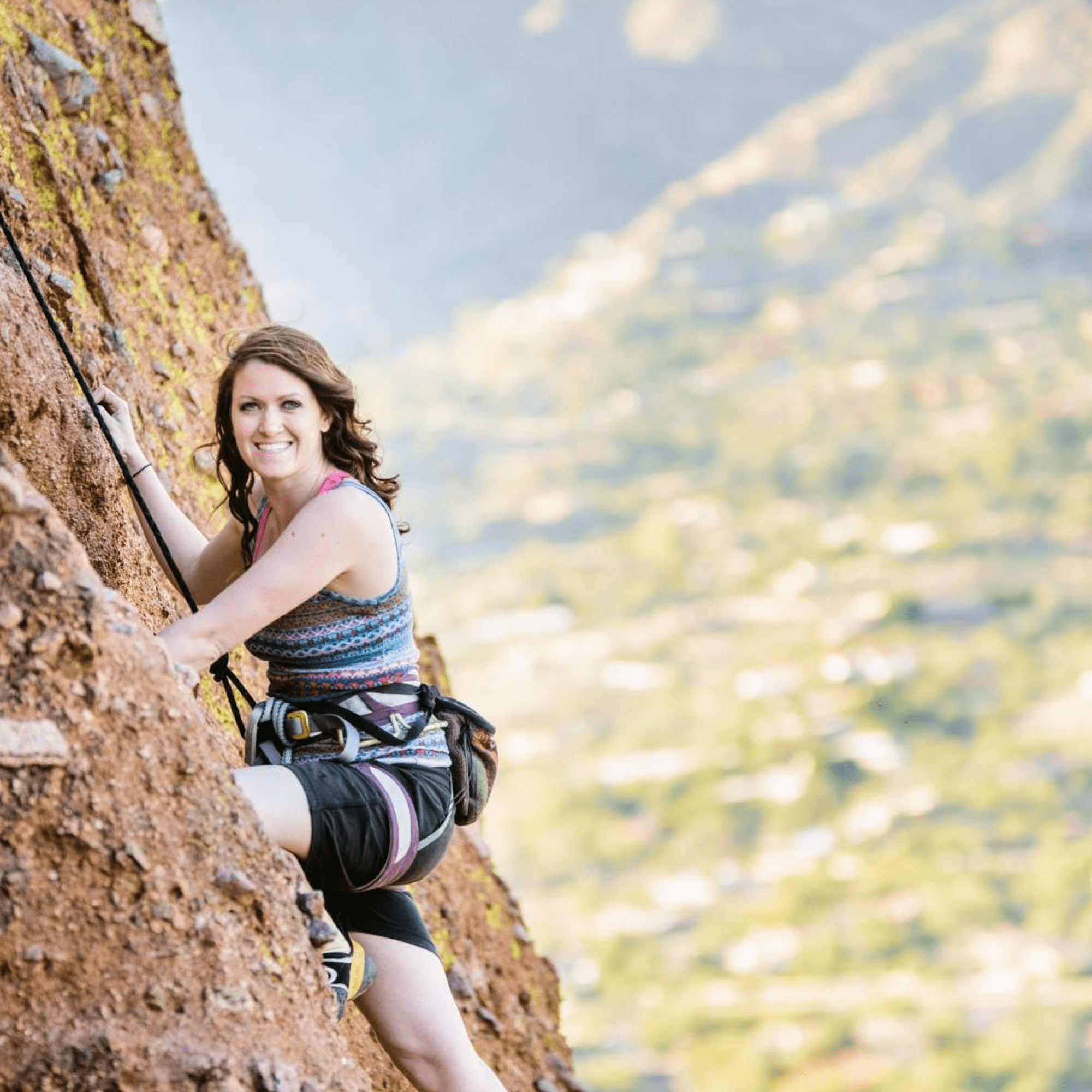 A Woman on a mountain climbing